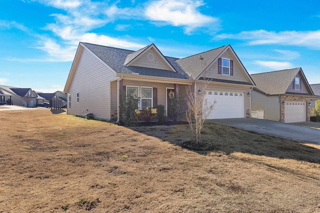 view of front of home featuring a front yard and a garage