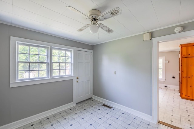 interior space featuring ceiling fan and ornamental molding