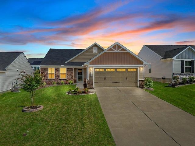 craftsman inspired home with a lawn and a garage