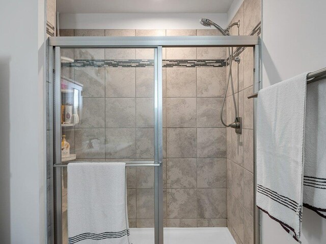 bathroom with a tile shower