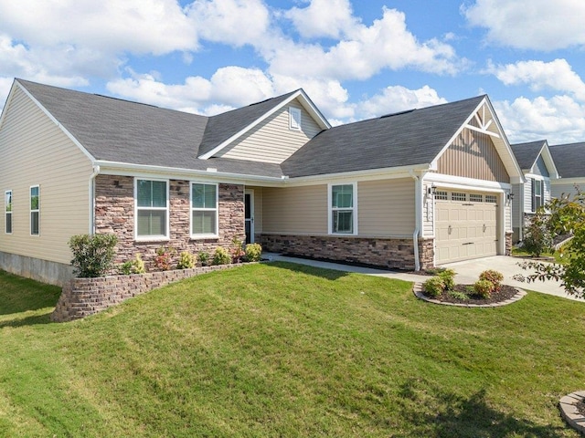 craftsman inspired home with a garage and a front lawn