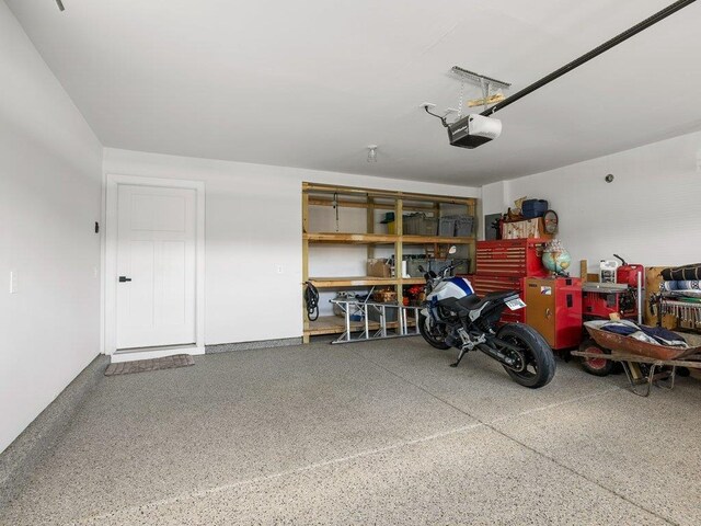 garage featuring a garage door opener