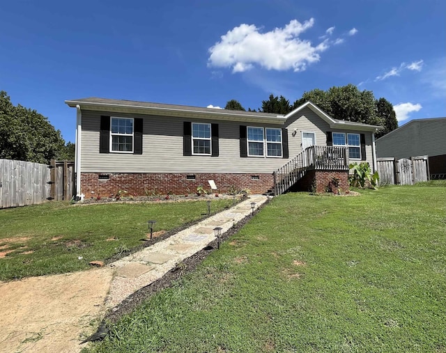 manufactured / mobile home with a front yard