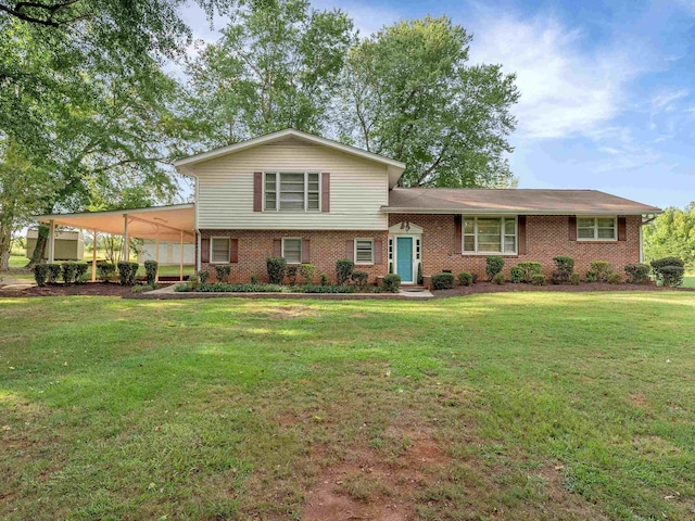 tri-level home featuring a front yard and a carport