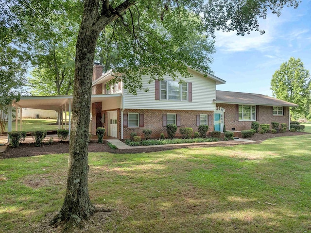 split level home with a carport and a front lawn