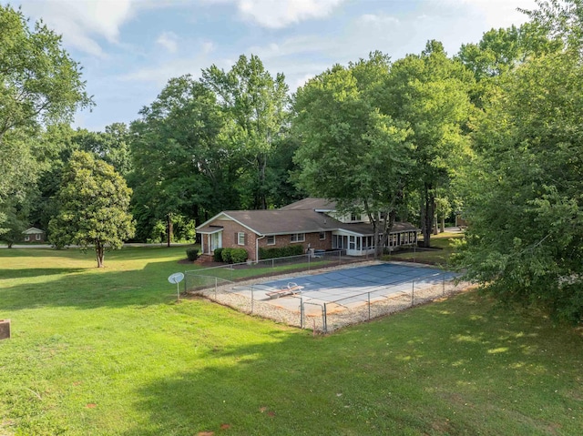 view of swimming pool with a lawn and a patio area