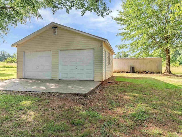 garage featuring a yard