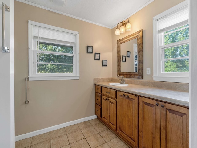 bathroom with tile patterned flooring, vanity, ornamental molding, and a notable chandelier