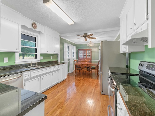 kitchen with white cabinetry, sink, and stainless steel appliances