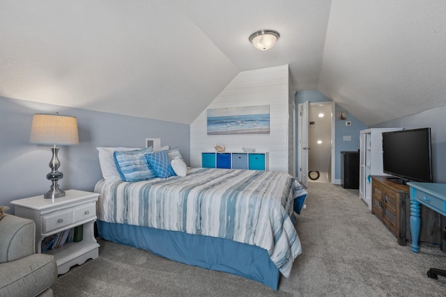 carpeted bedroom featuring lofted ceiling