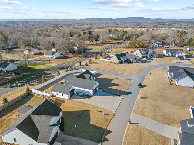 birds eye view of property featuring a mountain view