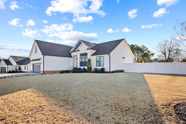 modern inspired farmhouse featuring a front yard