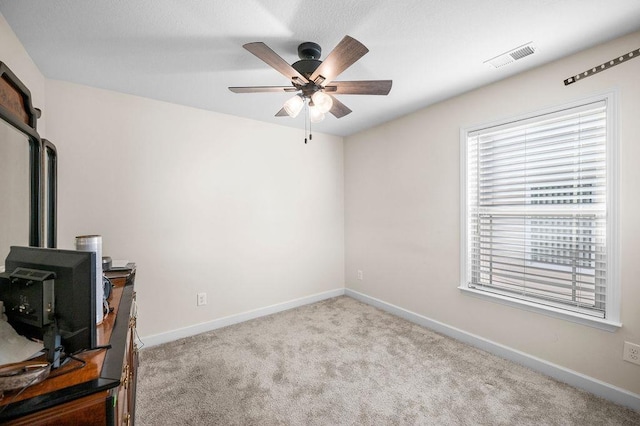 interior space with ceiling fan and a healthy amount of sunlight