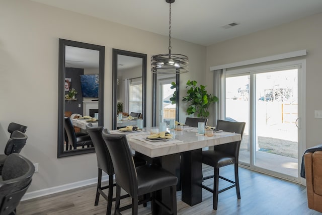 dining area featuring hardwood / wood-style floors