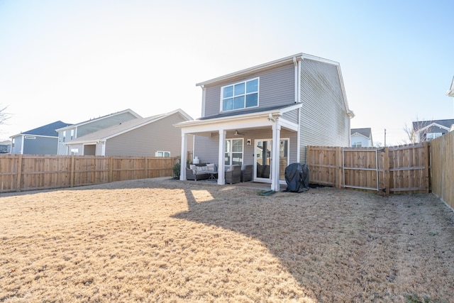 back of property with outdoor lounge area