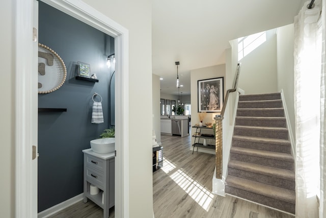 stairs featuring wood-type flooring