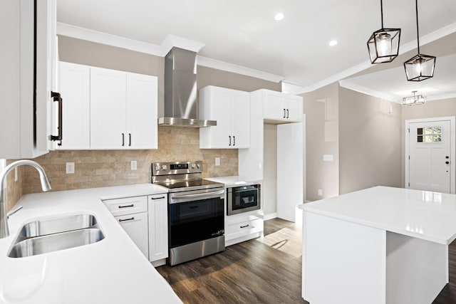 kitchen featuring stainless steel electric range oven, a kitchen island, sink, wall chimney range hood, and white cabinetry