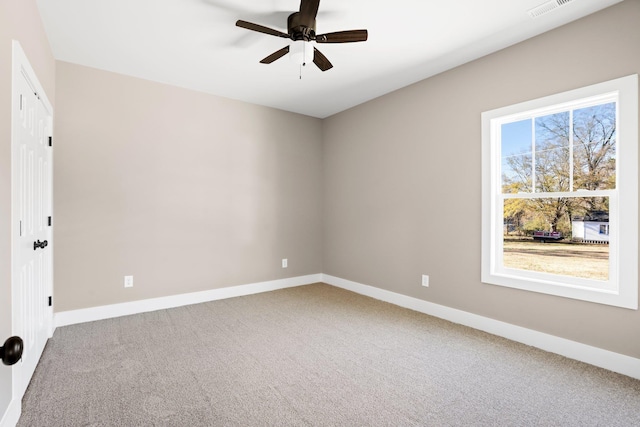 unfurnished room featuring carpet and ceiling fan