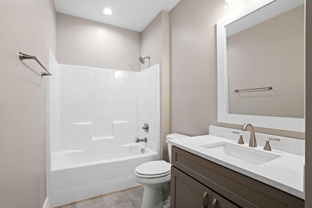 full bathroom with bathtub / shower combination, vanity, and toilet