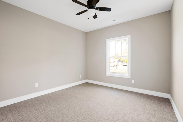 unfurnished room featuring ceiling fan and carpet floors