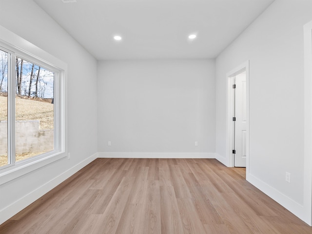 unfurnished room with light hardwood / wood-style floors