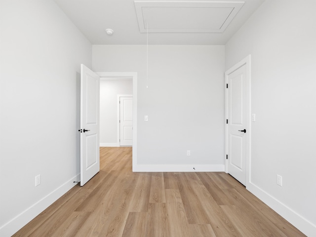 spare room with light wood-type flooring