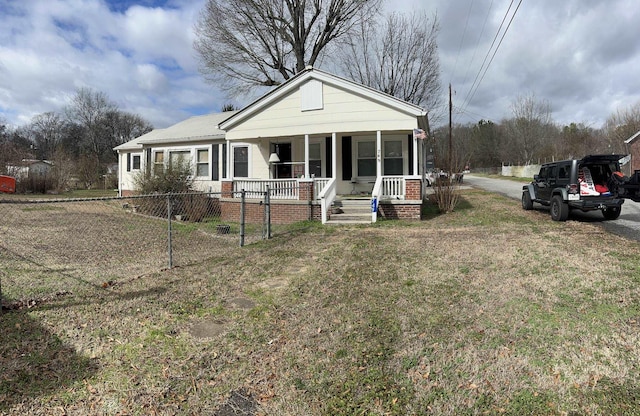 view of front facade with a porch and a front yard