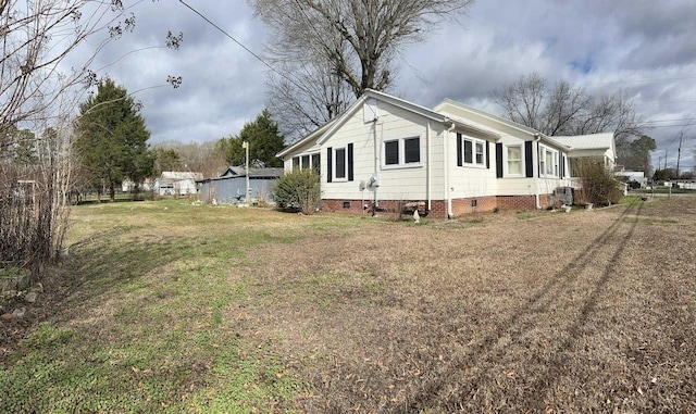 view of home's exterior featuring a lawn