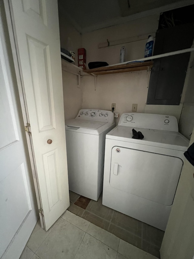 washroom with washer and dryer and light tile patterned floors