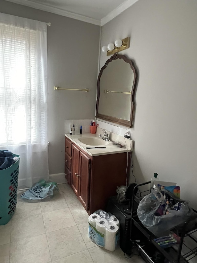 bathroom with tile patterned flooring, vanity, and ornamental molding