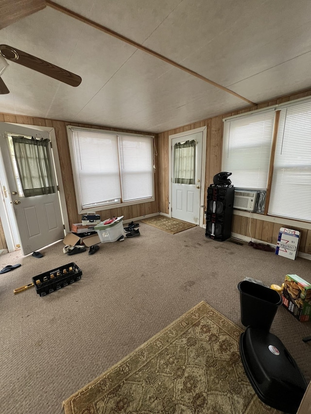 interior space with wooden walls and carpet