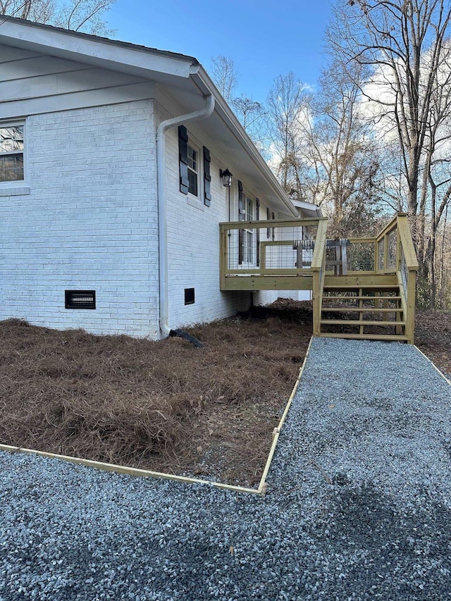 view of side of home with a deck