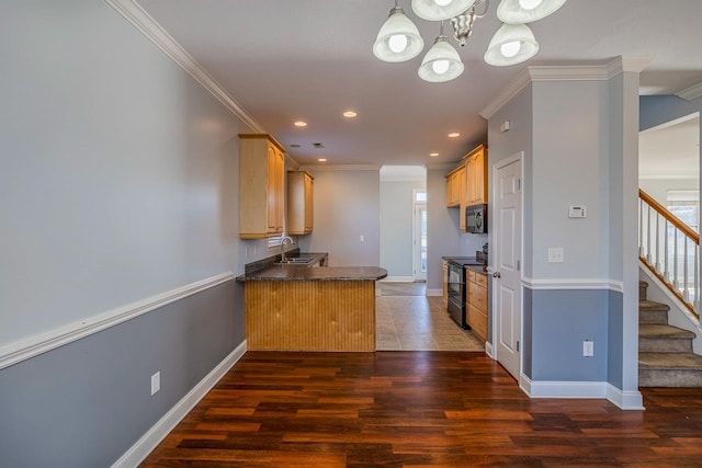 kitchen featuring sink, dark hardwood / wood-style floors, kitchen peninsula, crown molding, and black appliances