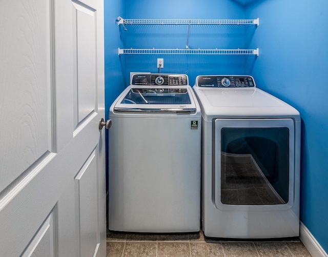 clothes washing area featuring washer and dryer