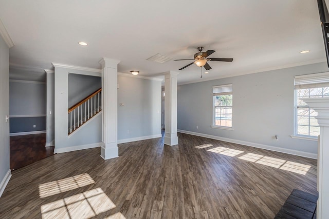 interior space featuring dark hardwood / wood-style floors, ornate columns, ceiling fan, and ornamental molding