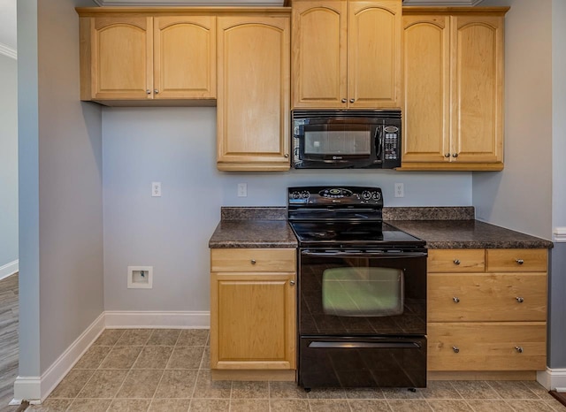 kitchen featuring light brown cabinets and black appliances