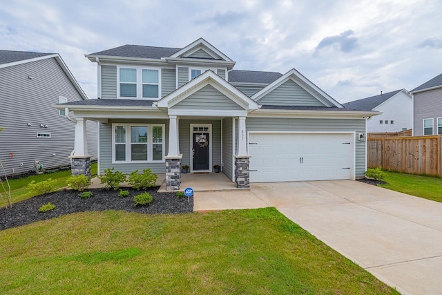 craftsman inspired home with a front lawn