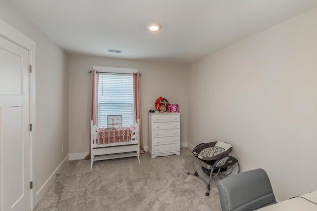 living area with light colored carpet