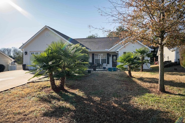 view of front facade featuring a front yard and a garage