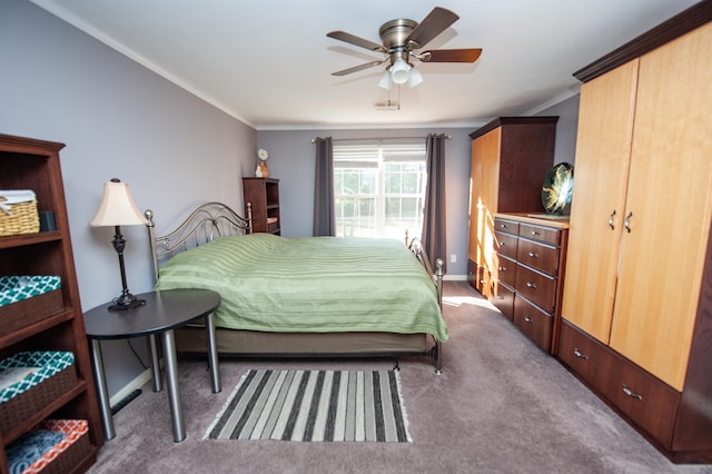 carpeted bedroom with ceiling fan and crown molding