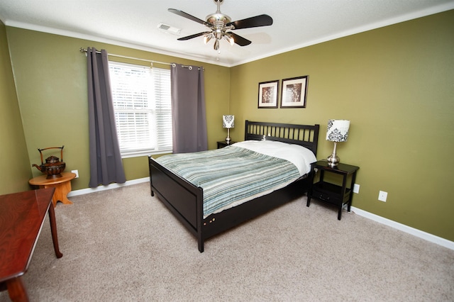 bedroom with light carpet, ceiling fan, and crown molding