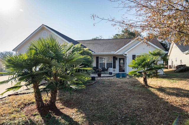 ranch-style home featuring a front yard