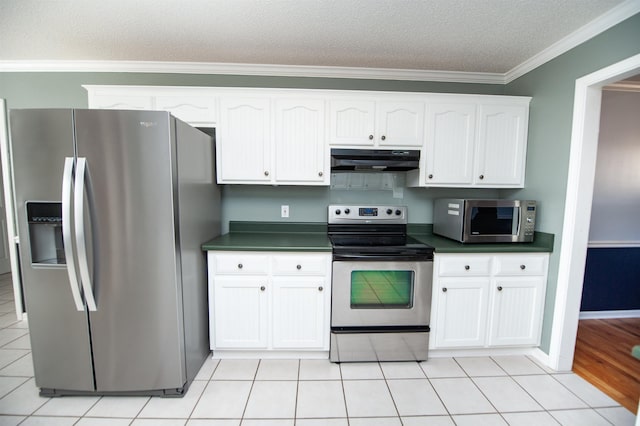 kitchen featuring white cabinets, a textured ceiling, stainless steel appliances, and ornamental molding