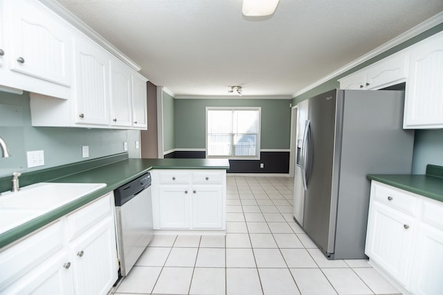 kitchen featuring white cabinets, kitchen peninsula, crown molding, and appliances with stainless steel finishes