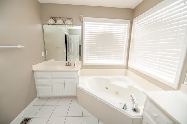 bathroom with tile patterned floors, tiled bath, and vanity