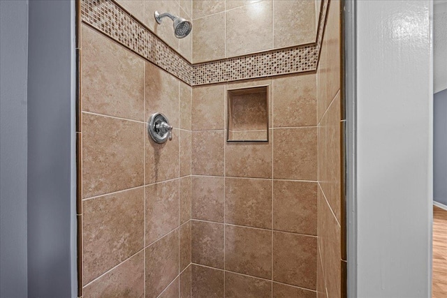 details featuring a tile shower