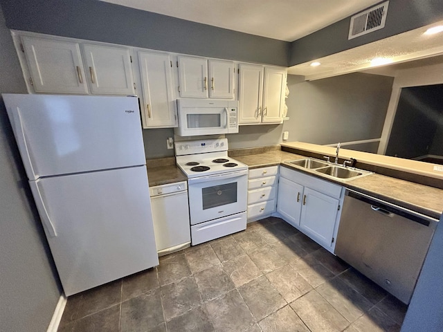 kitchen featuring kitchen peninsula, white appliances, white cabinetry, and sink