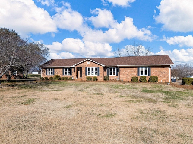 ranch-style home with a front lawn