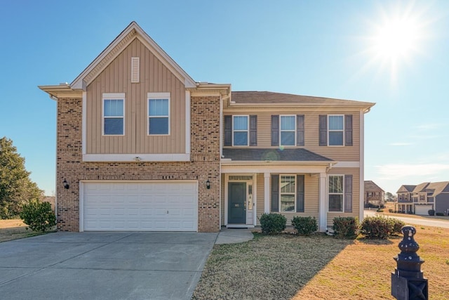 view of front of house with a front yard and a garage