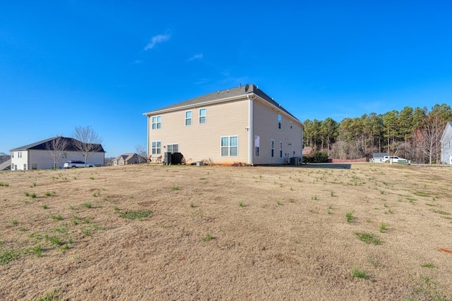 back of house featuring central AC